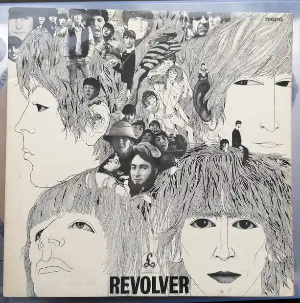 This is the iconic black-and-white album cover for The Beatles' 1966 album 'Revolver', featuring a surreal collage of the…