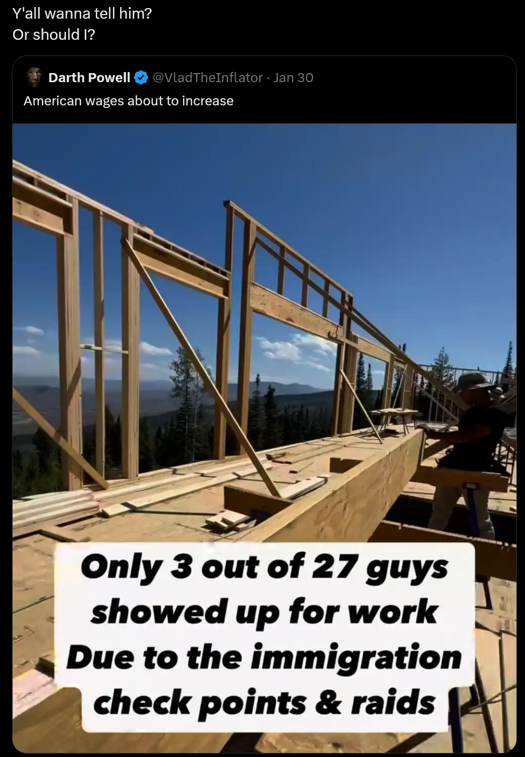 A photo shows a construction site with wooden framing under a clear blue sky, where one worker is visible on the right…
