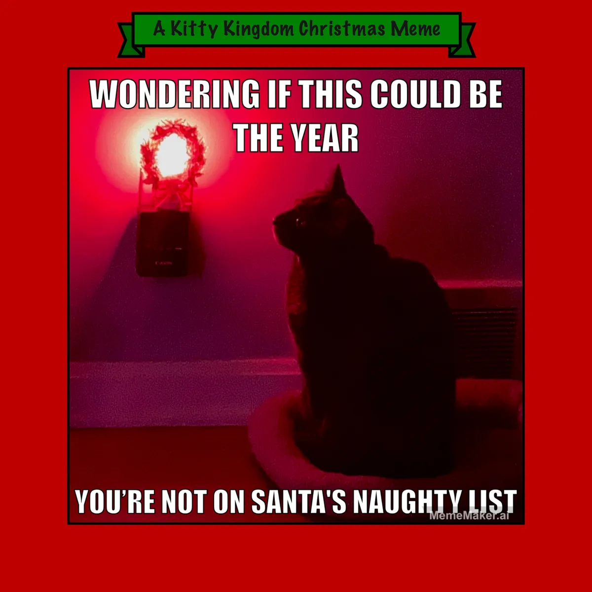 A dark silhouette of a cat sits on a cushion, looking up at a glowing Christmas wreath light on the wall. The image has a…