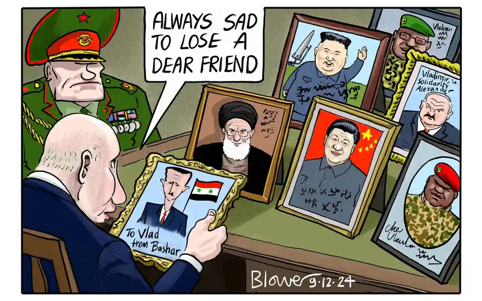 A cartoon depicts a man in a military uniform looking sad while holding a framed portrait of a man labeled 'To Vlad from…