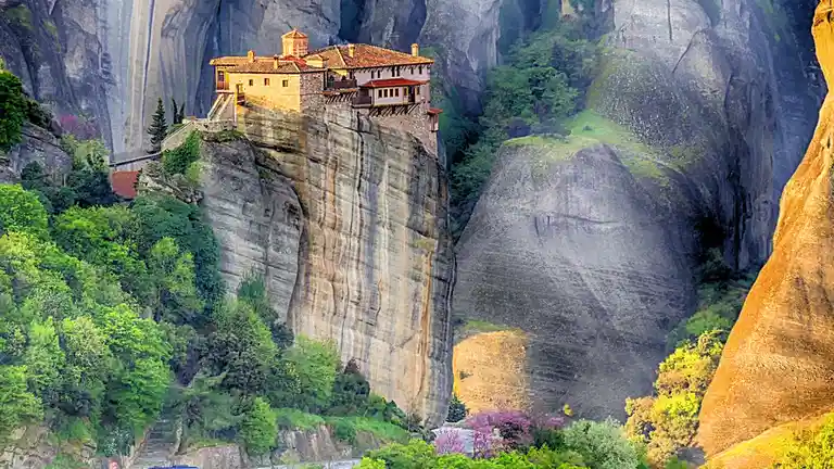 In Meteora, Rousanou monastery, once a secluded haven for male monks, now welcomes tourists with modern staircases…