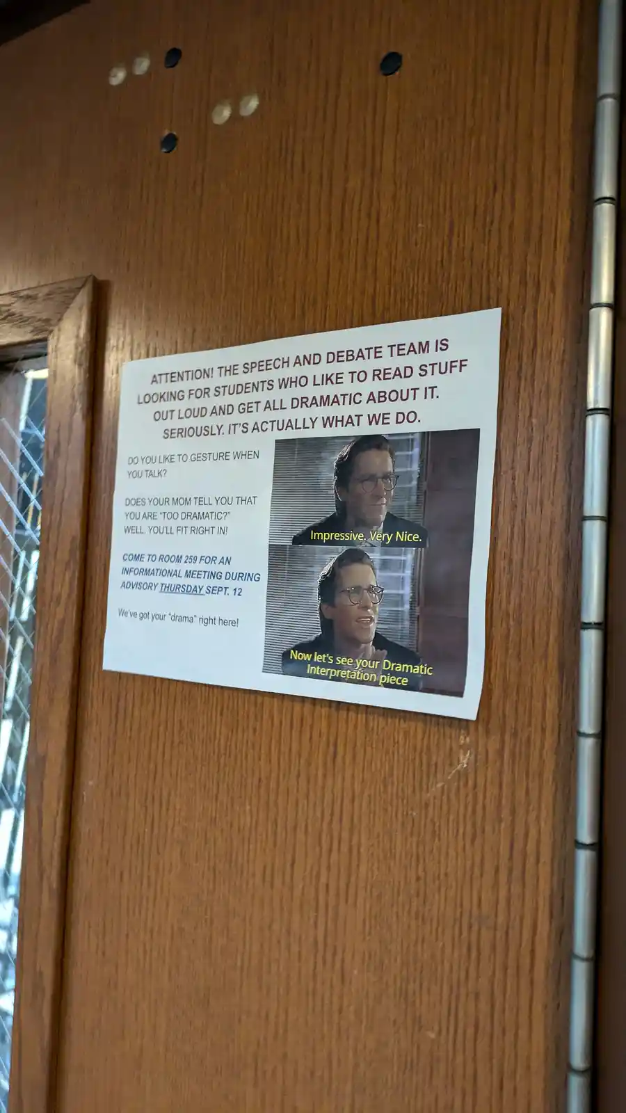 A flyer for a school speech and debate team is taped to a wooden door, featuring two images of actor Christopher Walken from…
