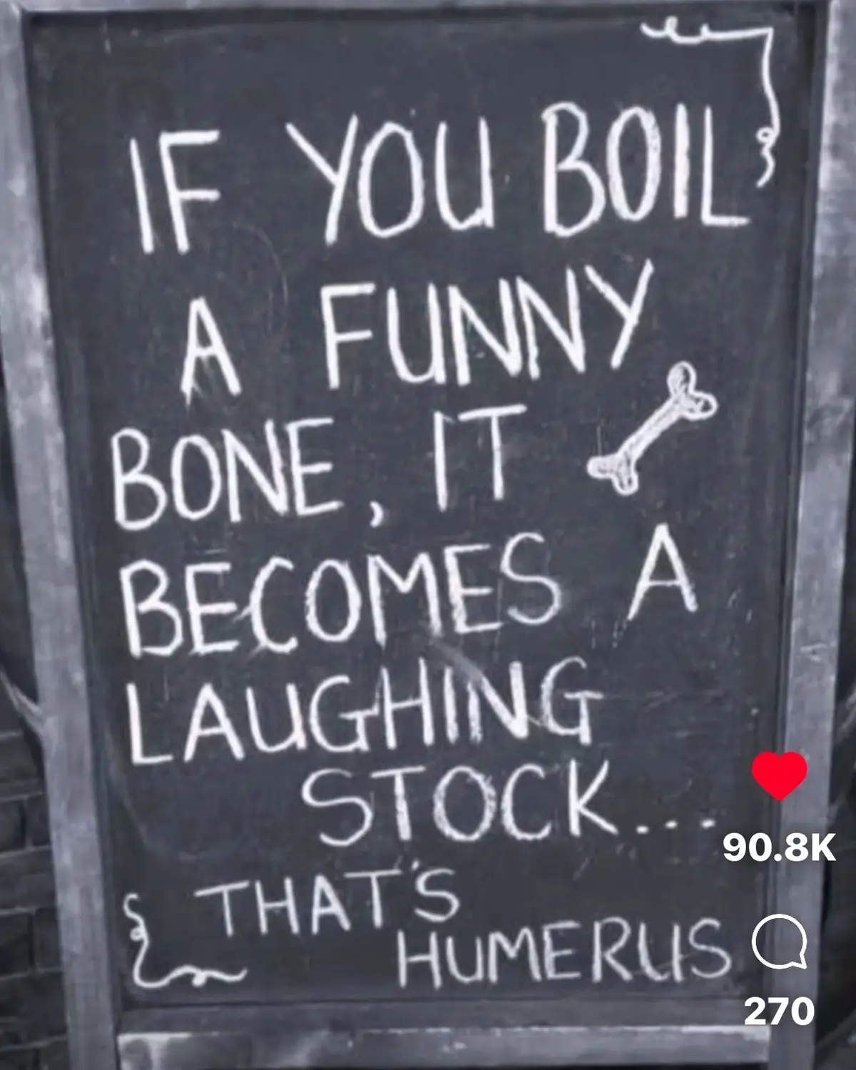 A chalkboard sign written in white chalk displays a pun: 'IF YOU BOIL A FUNNY BONE, IT BECOMES A LAUGHING STOCK... THAT'S…