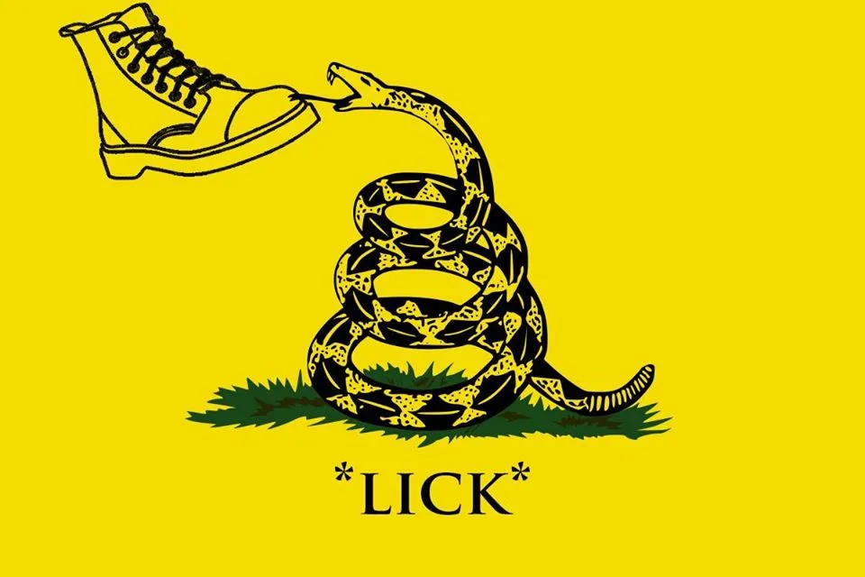A black-and-yellow illustration shows a coiled rattlesnake on grass, its tongue extended to lick the sole of a combat boot…