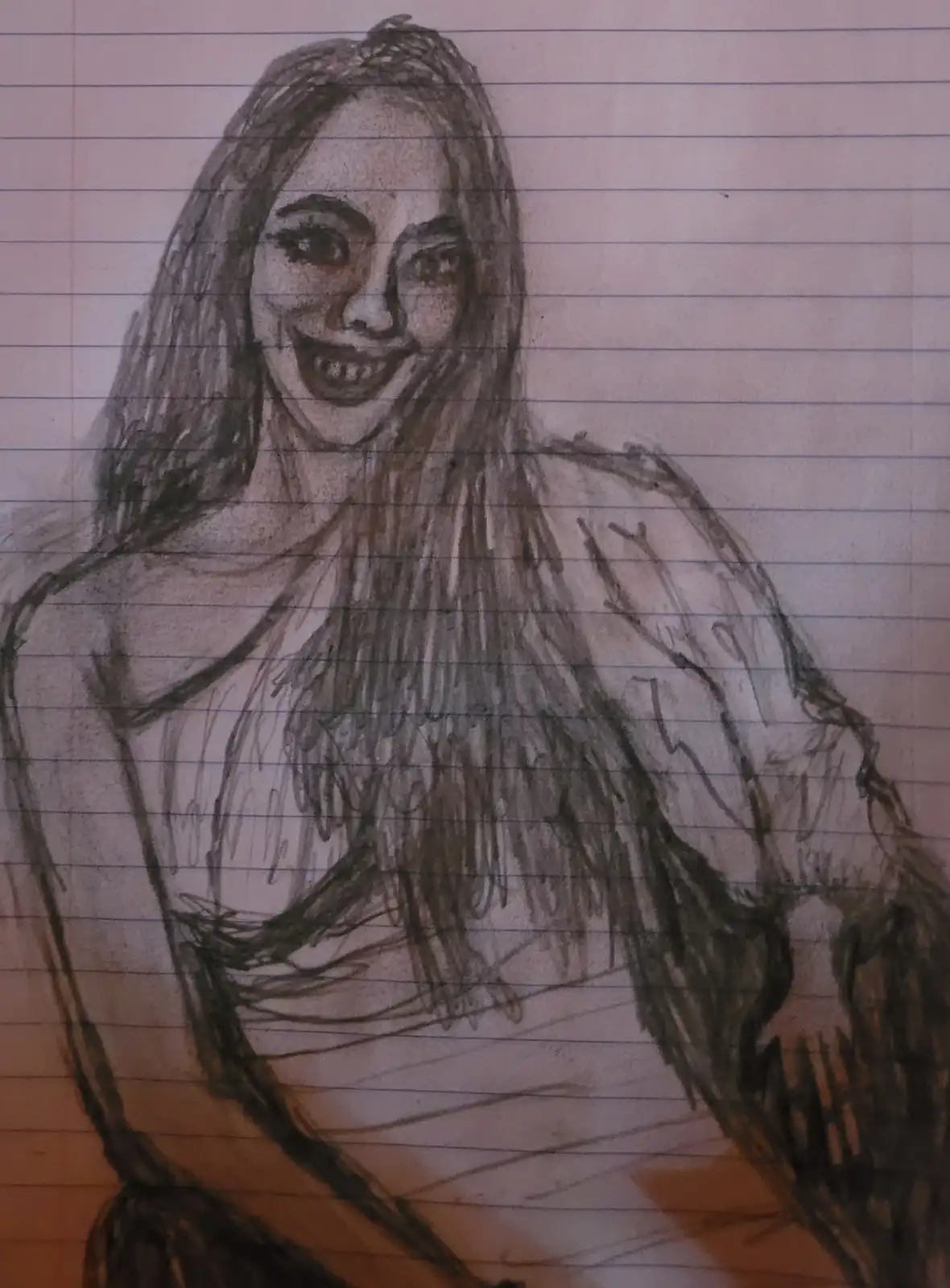 A hand-drawn charcoal sketch on lined notebook paper depicts a woman with long hair, a wide toothy grin, and a slightly…