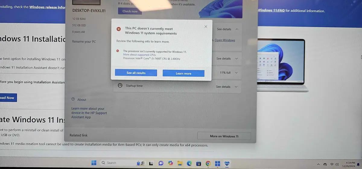 A screenshot of a Windows 11 installation screen showing a pop-up error message stating the PC doesn't meet system…