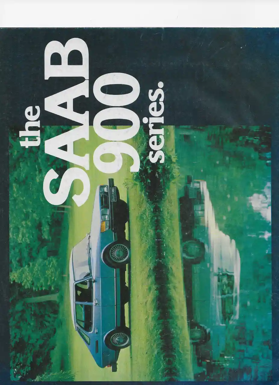 A vintage SAAB 900 car advertisement featuring a blue sedan on a grassy path with trees, overlaid with large white text…