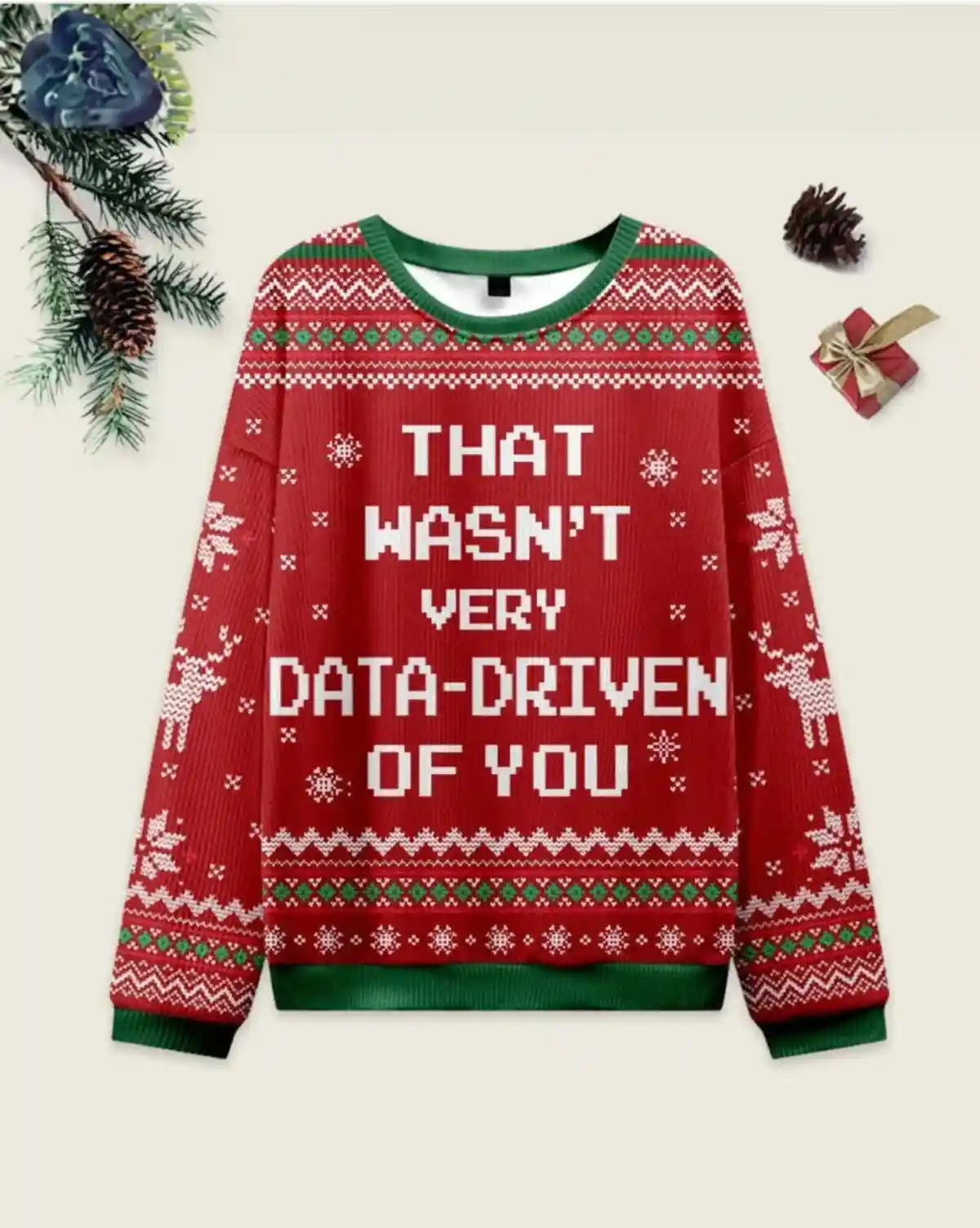 A red Christmas sweater with green trim and white snowflake patterns displays the text 'THAT WASN'T VERY DATA-DRIVEN OF YOU'…