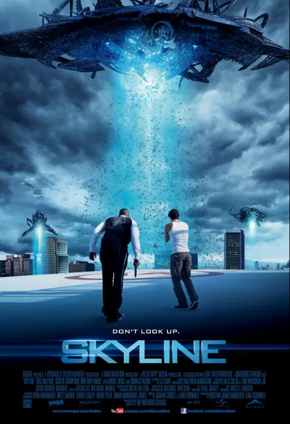 Two men stand on a rooftop overlooking a city as massive alien spacecraft hover overhead, beams of light shooting down and…