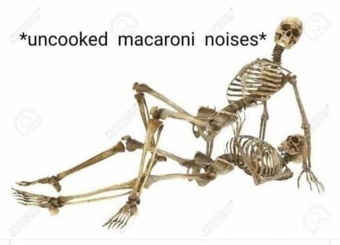 Two skeletons are shown in a suggestive, intimate pose against a plain white background. The larger skeleton is positioned…