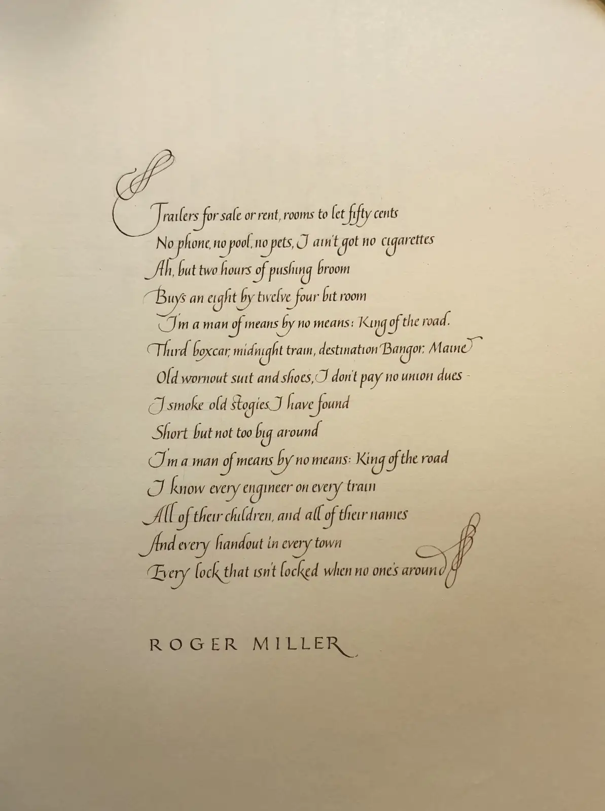 The image displays a handwritten poem in elegant cursive script on cream-colored paper. The text is a song lyric by Roger…