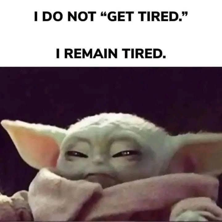 The image shows a close-up of the character Grogu (Baby Yoda) from Star Wars, wrapped in a pinkish blanket, with half-closed…