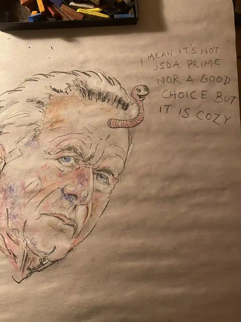 A hand-drawn sketch on paper shows a caricature of a man's face with a worm emerging from his hair. The worm has a smiling…