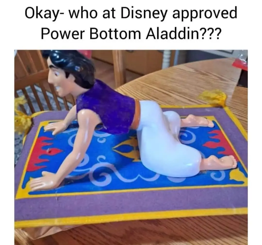 A plastic Aladdin action figure is shown crawling on a rug, but his white pants are comically inflated and bulging at the…