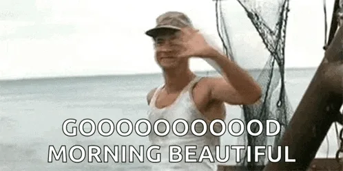 A man in a white tank top and cap stands by the ocean, waving enthusiastically in six identical frames. Each frame has the…