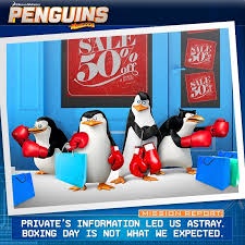 Three cartoon penguins in boxing gloves stand in front of a store with a 'SALE 50% OFF' sign. They hold shopping bags and…