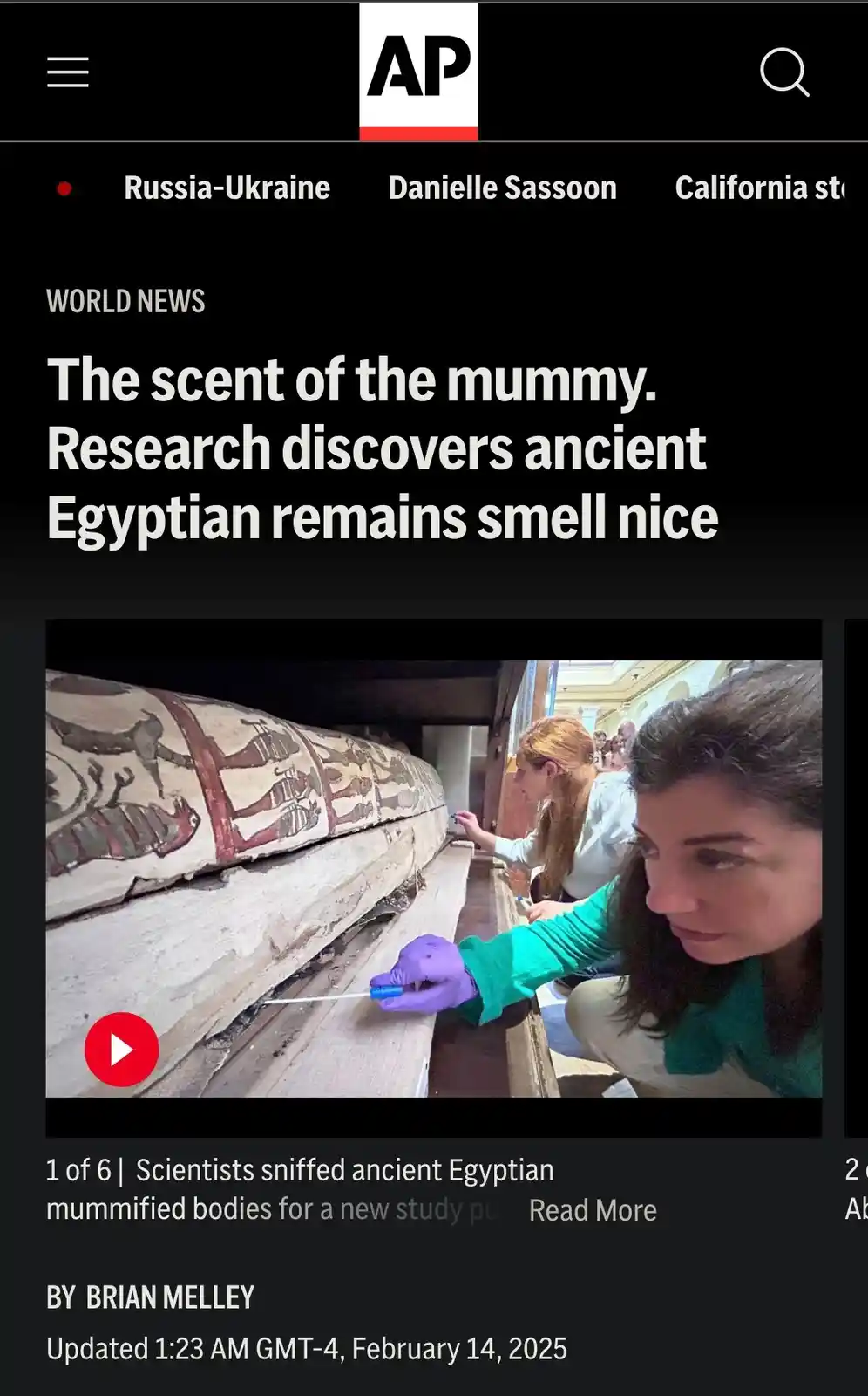 An AP News article screenshot shows scientists in a museum examining an ancient Egyptian sarcophagus. One scientist in a…