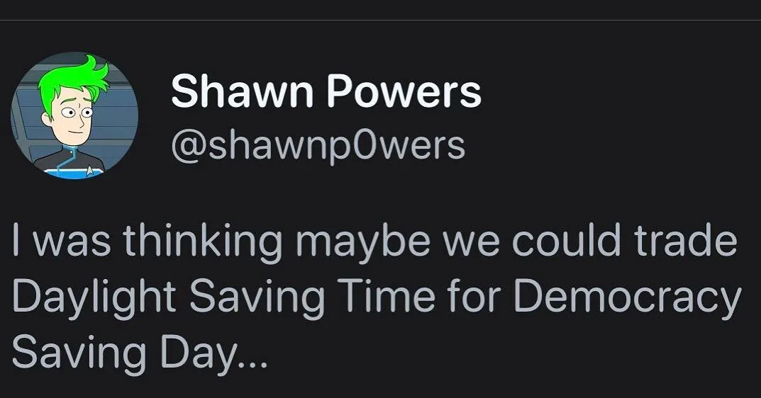 A screenshot of a tweet from a user named Shawn Powers with a cartoon avatar of a green-haired man. The tweet text reads: 'I…