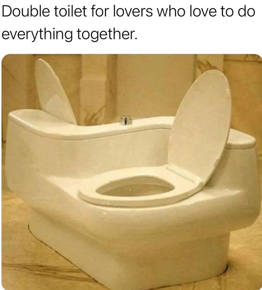 A white ceramic toilet with two separate bowls side-by-side, each with its own open lid, set against a beige tiled bathroom…