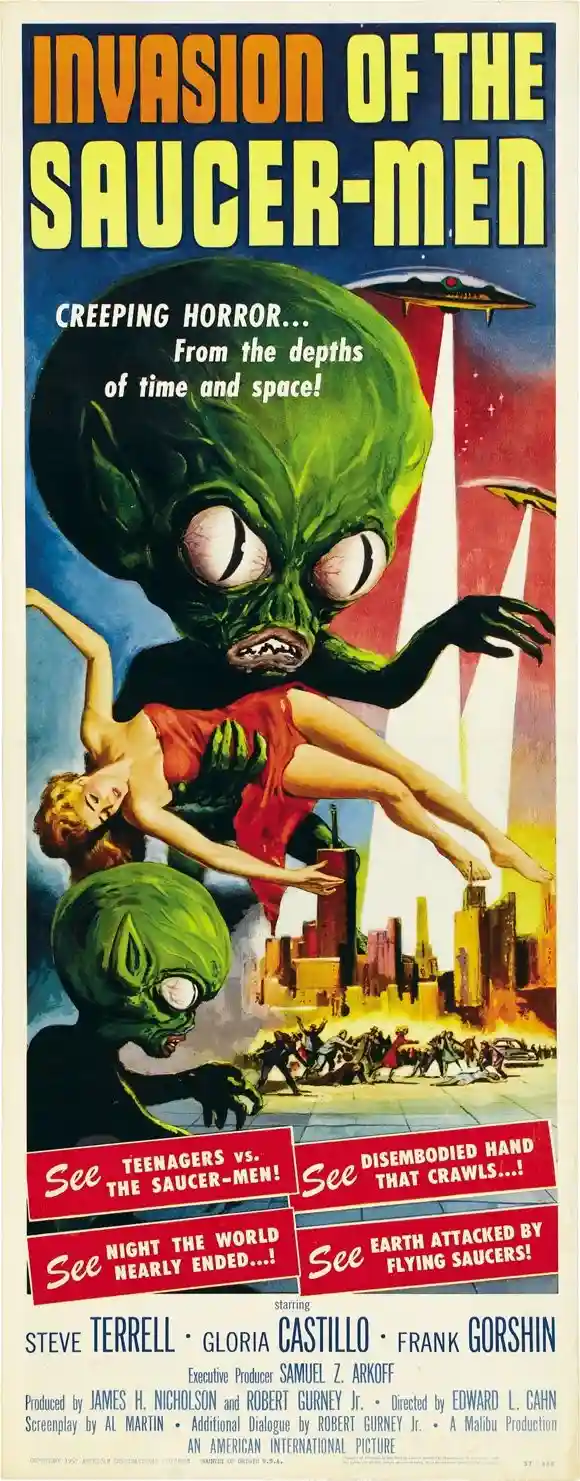 A vintage science fiction movie poster for 'Invasion of the Saucer-Men' depicts a large green alien with big eyes and sharp…