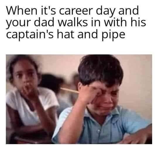 A photo shows a young boy in a school uniform crying while holding his head, with another child blurred in the background…