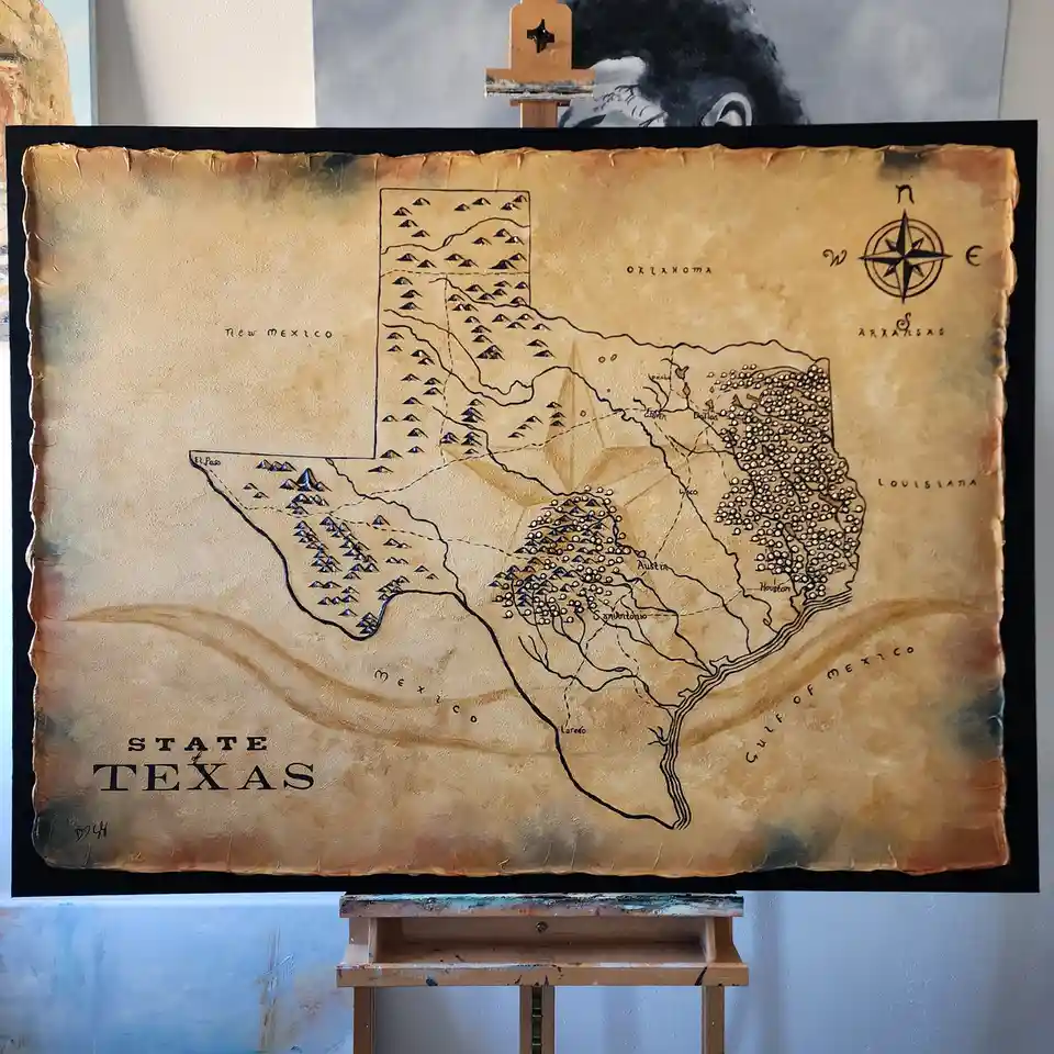 A textured, vintage-style map of Texas on canvas, displayed on an easel, shows the state's outline with mountains, rivers…