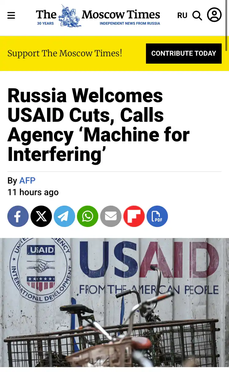 A screenshot of a news article from The Moscow Times with the headline 'Russia Welcomes USAID Cuts, Calls Agency 'Machine…