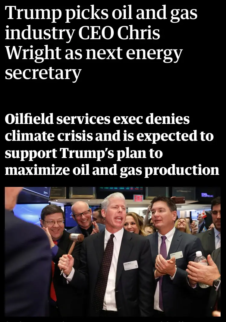 The image shows a man in a suit holding a gavel while surrounded by other people in business attire, some clapping and…