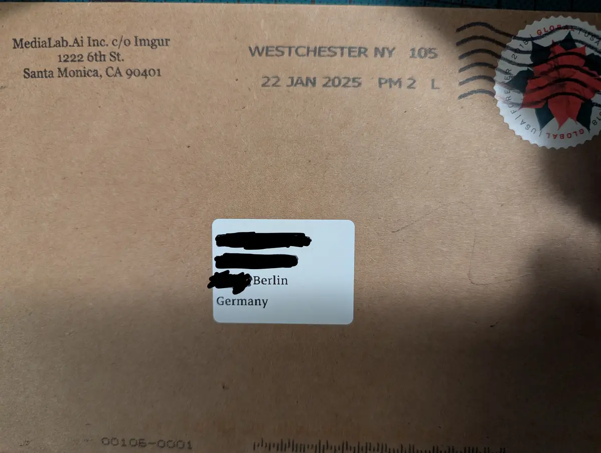A brown envelope addressed to MediaLab.Ai Inc. in Santa Monica, CA, with a 'WESTCHESTER NY 105' postmark and a 'GLOBAL USA…