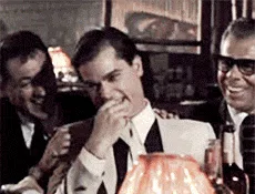 A six-panel sequence from a vintage film shows a man in a white suit progressively reacting with increasing shock and horror…