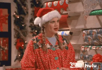 A woman in a red holiday-themed pajama set and a Santa hat is shown in two rows of three panels each. In the top row, she…