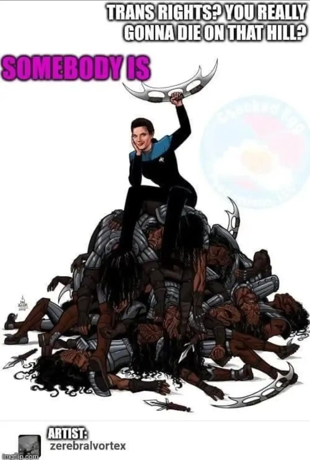 A woman in a Starfleet uniform sits triumphantly atop a pile of defeated, armored, dark-skinned warriors, holding up a…