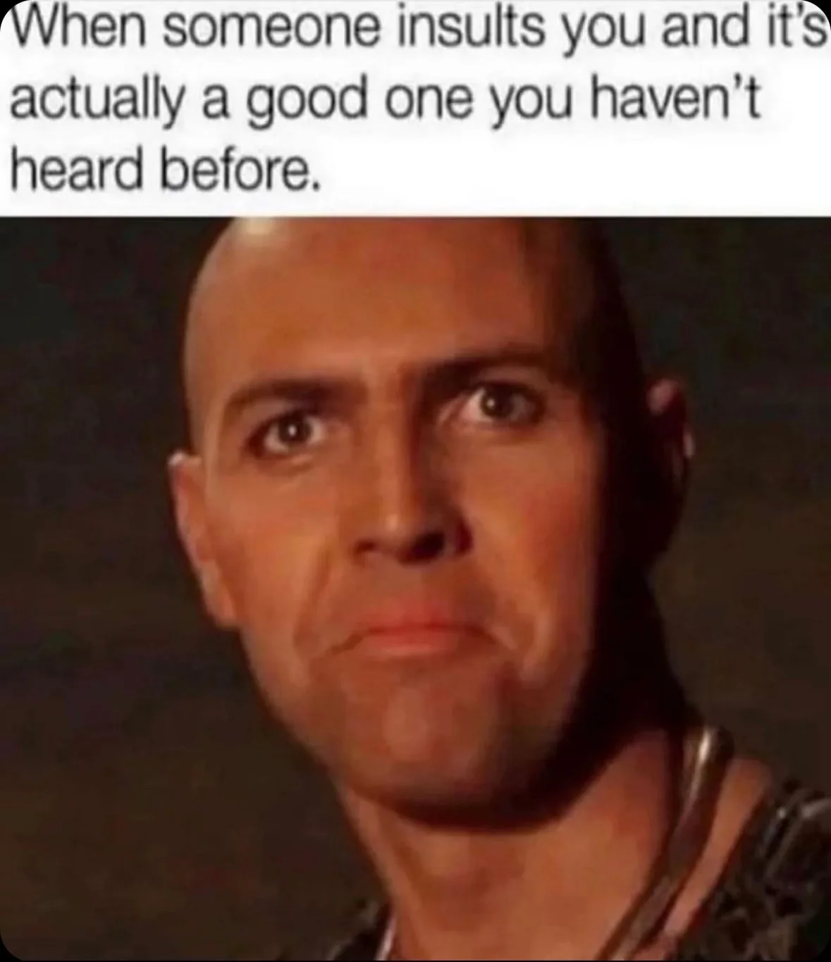 A close-up image of a bald man with a serious, slightly confused expression, looking directly at the camera. The text…