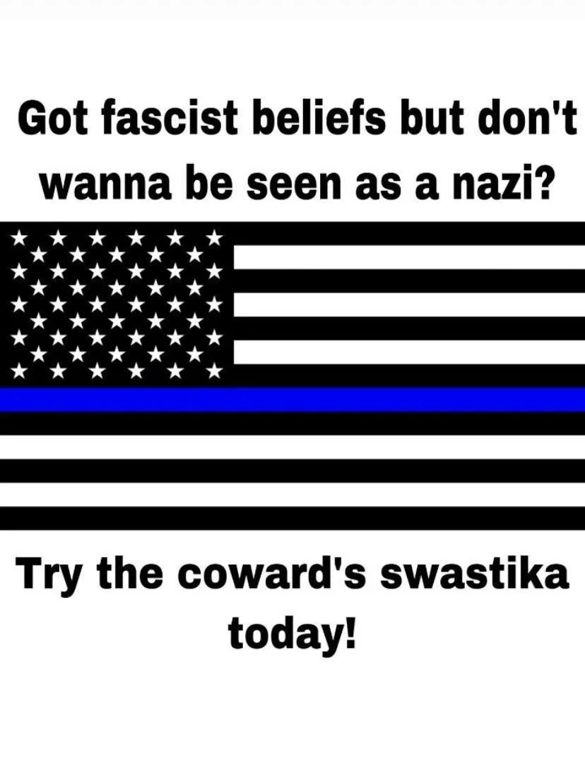 The image displays a black and white American flag with a single blue stripe replacing the traditional red stripe, commonly…