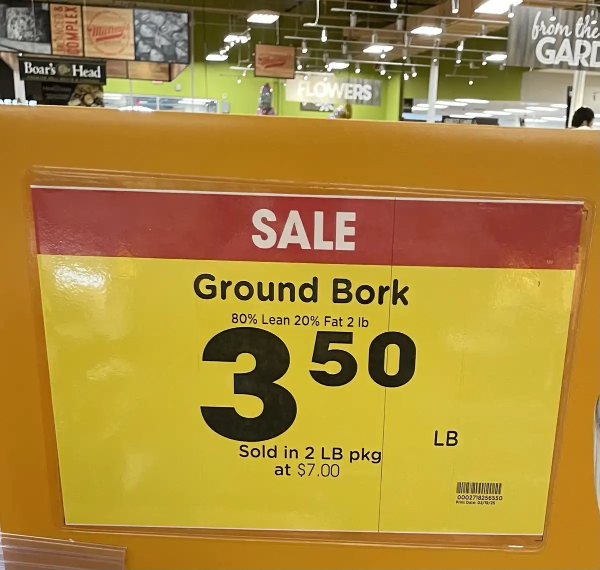 A supermarket price tag for 'Ground Bork' humorously mislabeled as a meat product, priced at $3.50 per pound, with details…