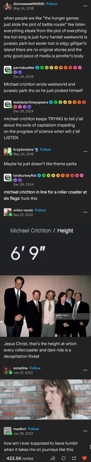 The image displays a photo of Michael Crichton standing among a group of people, visibly taller than everyone else. Overlaid…