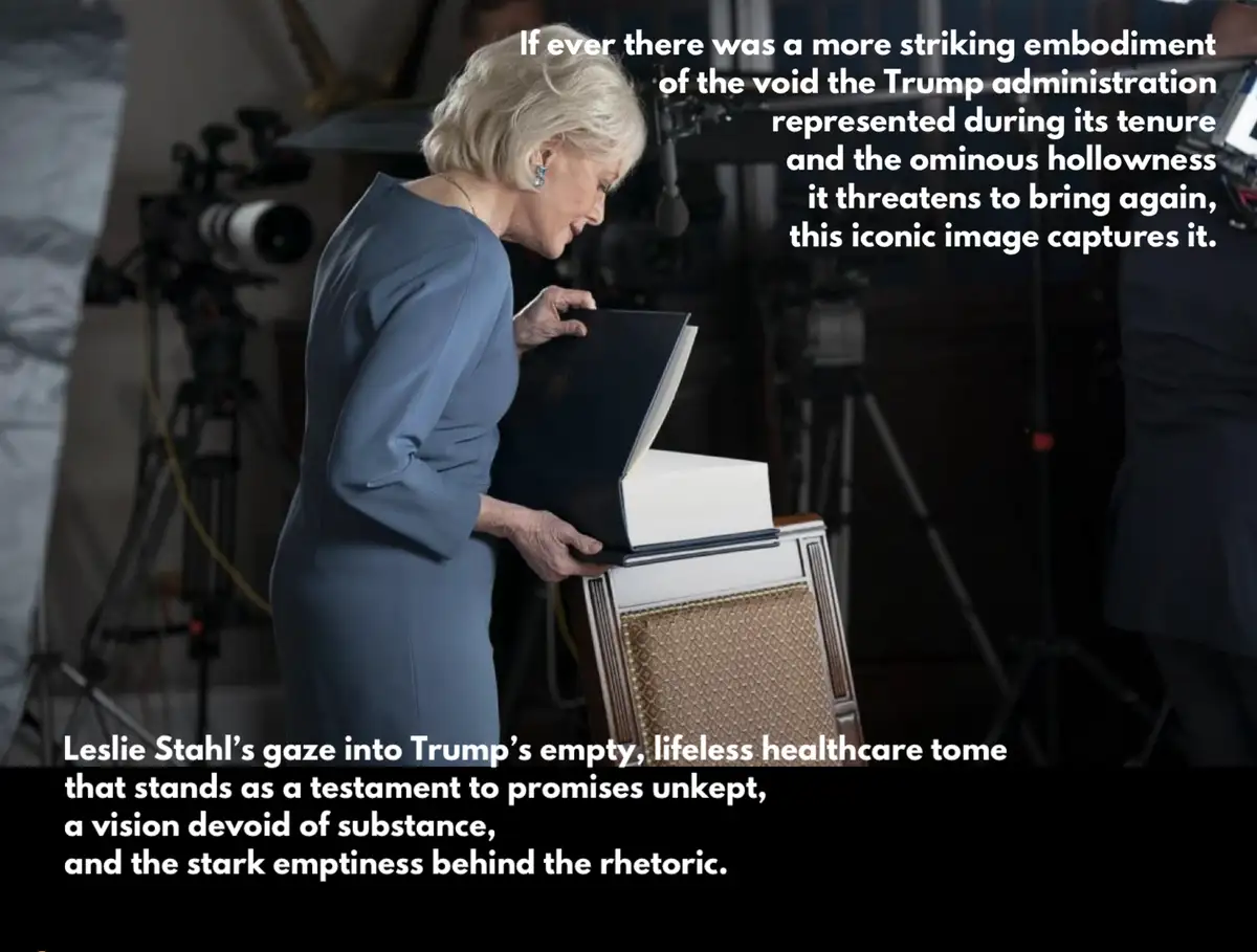 A woman in a blue dress leans over a small, empty-looking book resting on a chair, looking down at it with a serious…