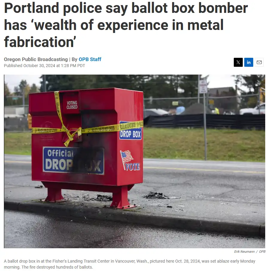A red, damaged ballot drop box stands on a sidewalk, wrapped in yellow police tape, with visible burn marks and melted…