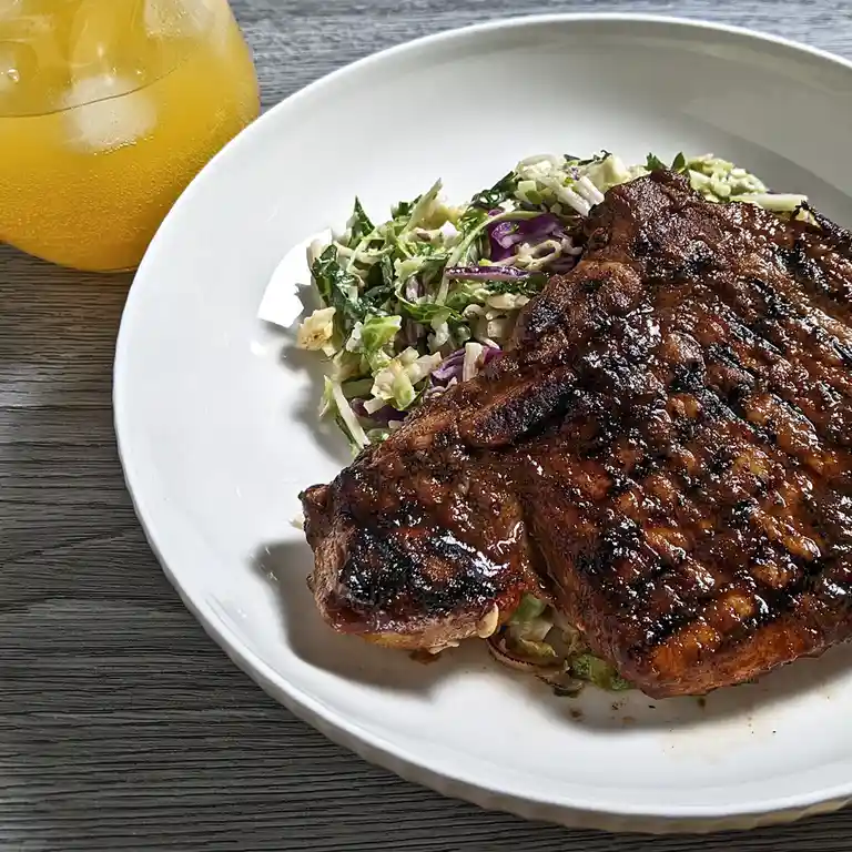 Delicious Hoisin and Ginger Beer Marinated Pork Chop with a Refreshing Mango Gin Mocktail