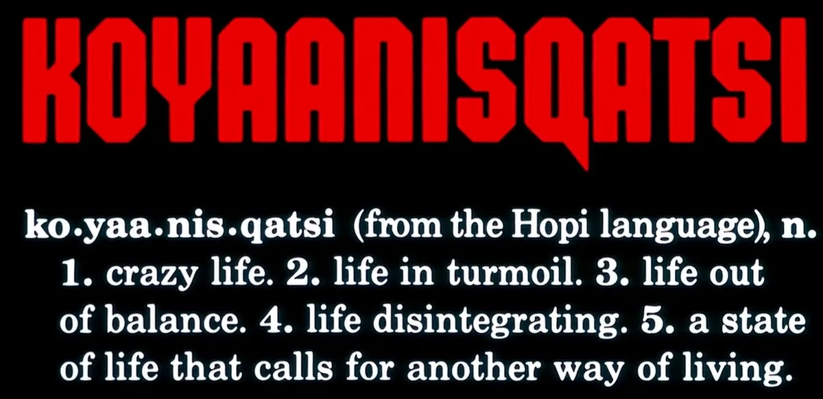 The image displays the word 'KOYAANISQATSI' in large red block letters at the top against a black background. Below it…