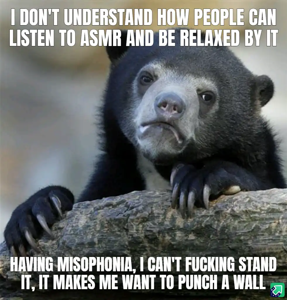 A close-up photo of a sun bear with a confused and slightly disgusted facial expression, resting its paws on a log. The…