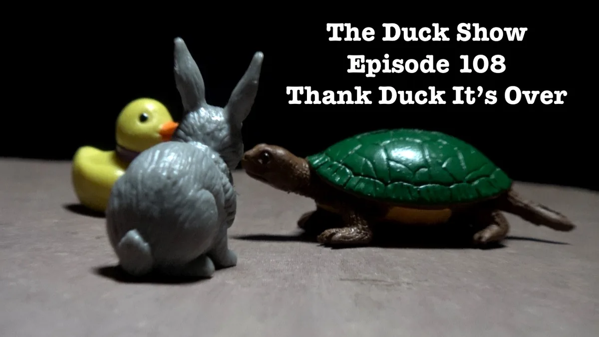 A still image shows three plastic toy animals: a yellow rubber duck, a grey plastic rabbit, and a green plastic turtle…