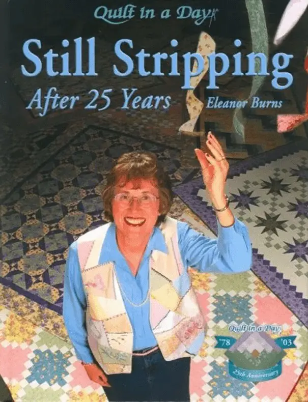 The image shows the cover of a book titled 'Quilt in a Day: Still Stripping After 25 Years' by Eleanor Burns. A smiling…