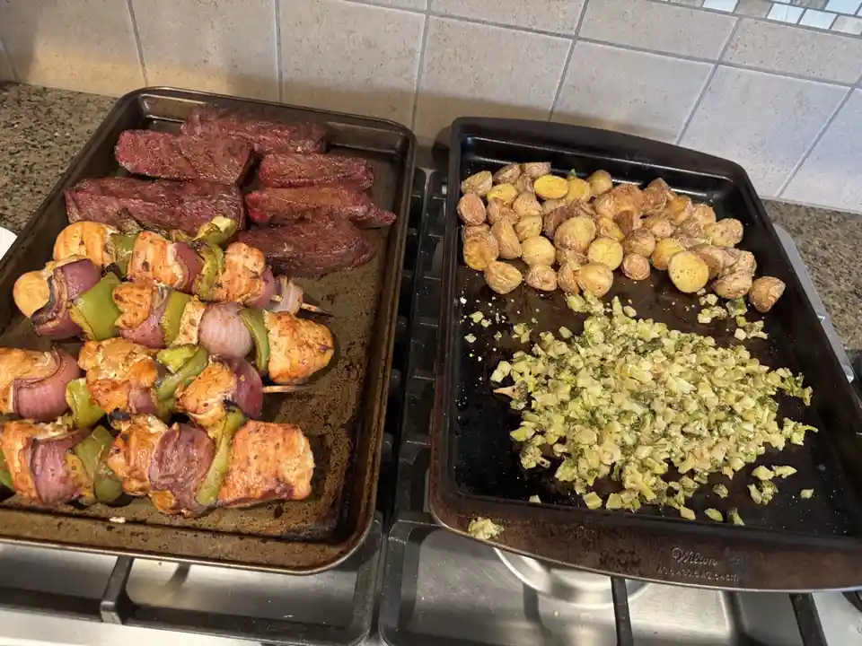 A Feast of Smoked Steaks, Chicken Kebabs, Crispy Potatoes, and Broccoli