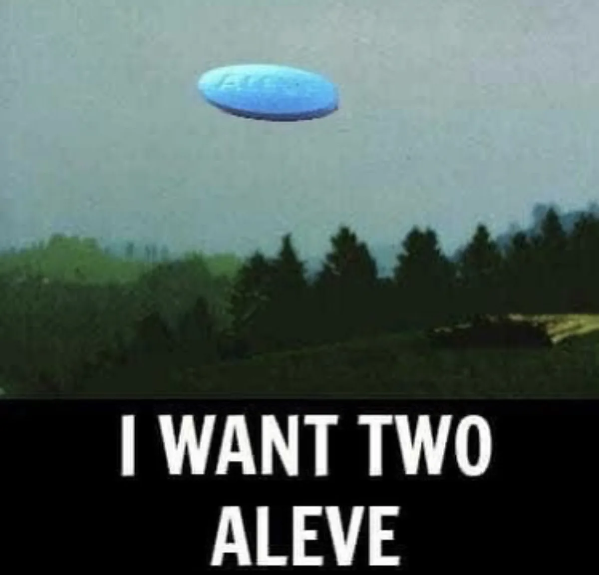A blue pill-shaped object floats in the sky above a forested landscape. The image has a black banner at the bottom with…