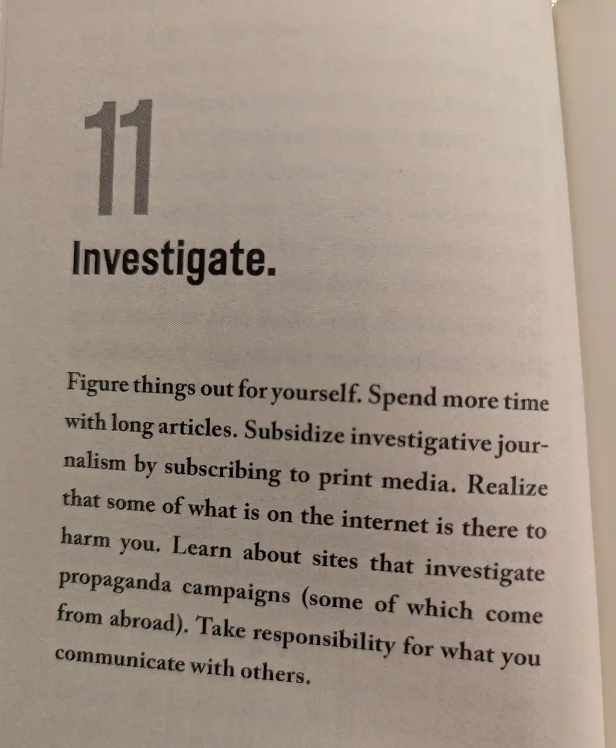 A close-up of a printed page showing the number 11 and the word 'Investigate.' followed by a paragraph of advice about…