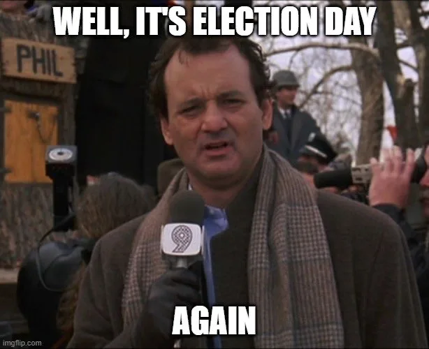 A man in a brown coat and scarf holds a microphone with a '9' logo, looking exasperated. The text overlaid on the image…