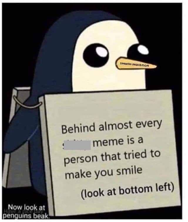 A cartoon penguin wearing a dark hooded robe holds a sign that reads 'Behind almost every meme is a person that tried to…