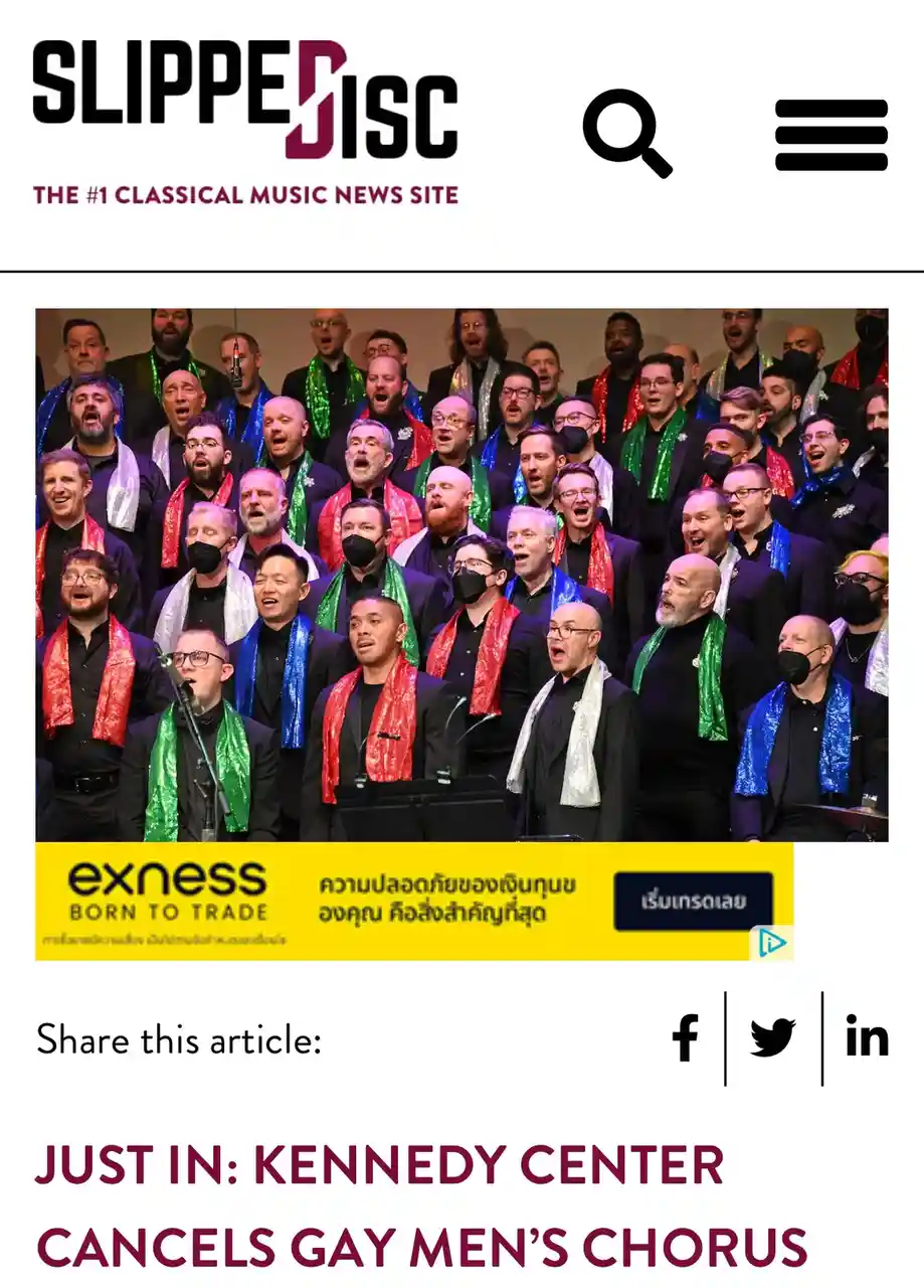 A screenshot of a news article from 'Slipped Disc' shows a photo of a men's choir wearing festive, colorful scarves while…