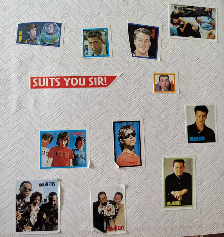 A collection of vintage 'Smash Hits' magazine celebrity stickers featuring characters like Buzz Lightyear, Brad Pitt, and…